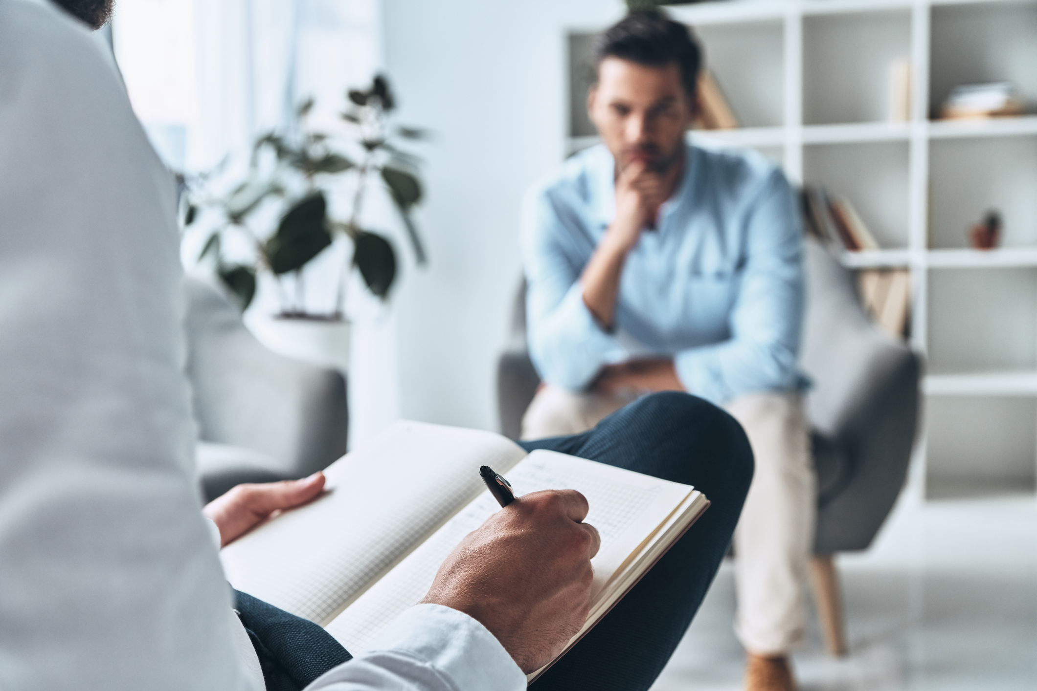 Psychiatrist speaking with a patient during an evaluation
